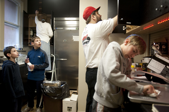 WASHINGTON, DC -MARCH  28:  from left to right,  Dean Cooper, 8,  Cole Cooper, 12, Bracha Reznik,    (left) Michael Perkins  and Jared Cooper, 11 clean  the Kesher Israel Congregation Synagogue for Passover. One of the many rituals around passover which begins at sundown on Monday,  involves cleaning the home and synagogue in preparation for the Jewish Holiday--external cleansing which reflects an internal cleansing and preparation of the self. One of the last details in this cleansing is to round up all the hametz, or leavened food,  which is forbidden during passover.  Photos taken on March 28, 2010 in Washington, DC   (Photo by Marvin Joseph /The Washington Post)   StaffPhoto imported to Merlin on  Sun Mar 28 13:53:01 2010